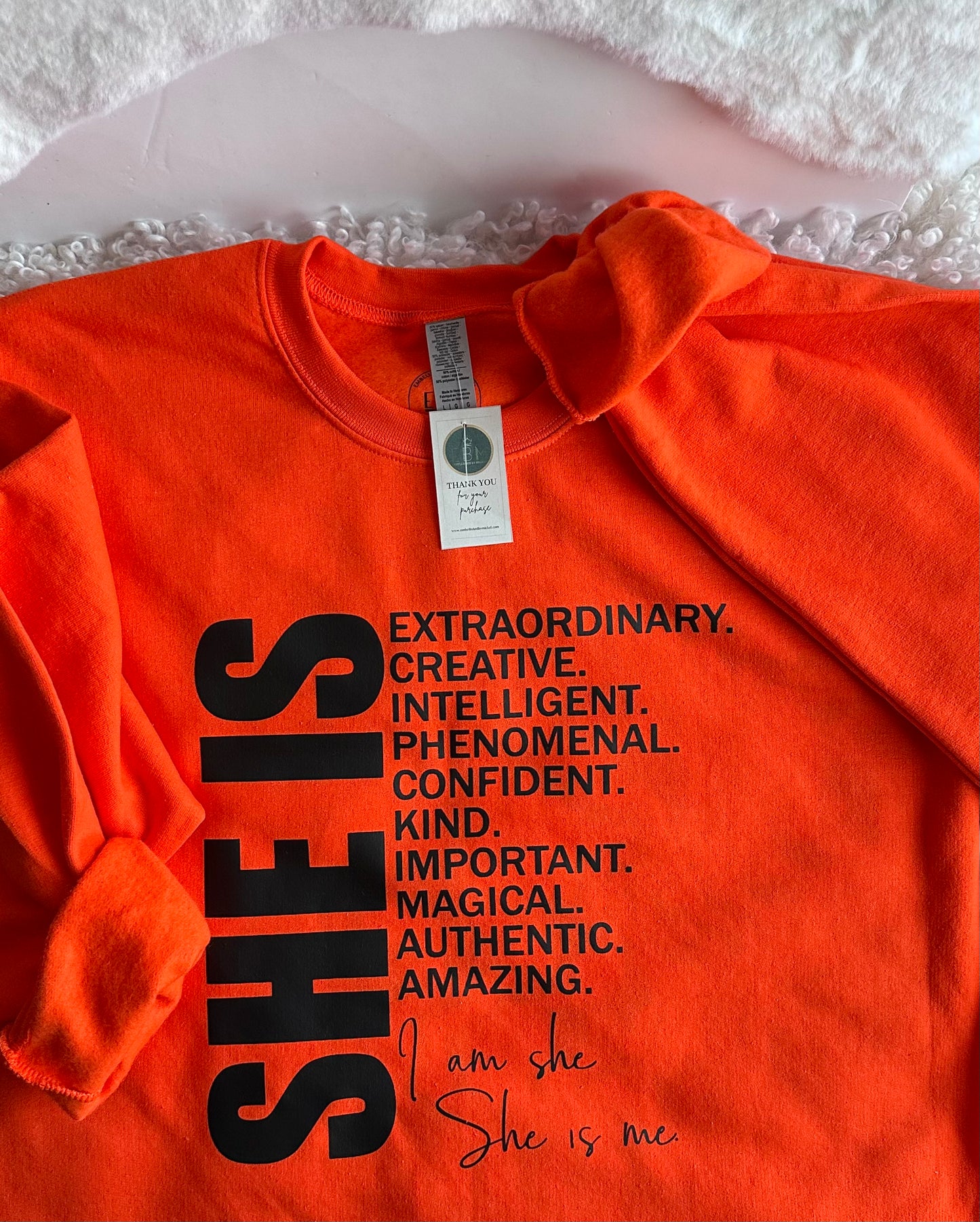 EBM’S SHE IS Orange Crewneck Sweater